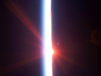Sunrise in Space This view featuring a sunrise dissecting a line of airglow of Earth's atmosphere was photographed by an STS-114 crewmember onboard Space Shuttle Discovery after departure from the International Space Station.
