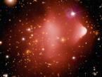 Searching for Primordial Antimatter Officially known as 1E 0657-56, the Bullet Cluster was formed after the violent collision of two large clusters of galaxies. Llocated about 3.8 billion light years from Earth, this image combines an image from NASA's Chandra X-ray Observatory with optical