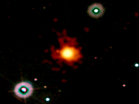 This image merges data from Swift's Ultraviolet/Optical (blue, green) and X-Ray (orange, red) telescopes. No visible light accompanied the burst, which hints at great distance. The image is 6.3 arcminutes wide.