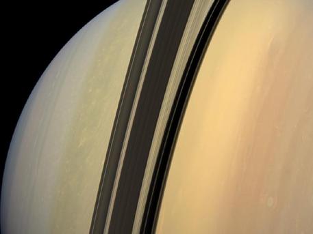 Natural color mosaic of planet Saturn and its main rings. Saturn sports  differently colored bands of weather in this image. The Stock Photo - Alamy