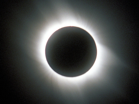 This photograph shows the Sun's corona, which only becomes visible to the unaided observer during a total solar eclipse. Then, the light from the photosphere is fully masked by the Moon.