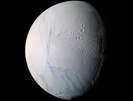 As it swooped past the south pole of Saturn's moon Enceladus on 14 July 2005, Cassini acquired high resolution views of this puzzling ice world. From afar, Enceladus exhibits a bizarre mixture of softened craters and complex, fractured terrains.