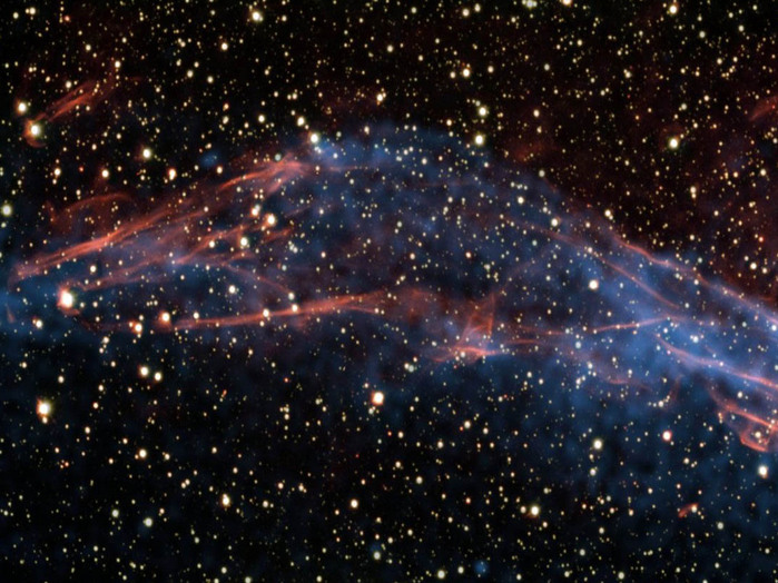 Image of part of a stellar remnant whose explosion was recorded in 185 AD. By studying this remnant in detail, a team of astronomers was able to solve the mystery of the Milky Way’s super-efficient particle accelerators. North is toward the top right and east to the top left. The image is about 6 arc minutes across.