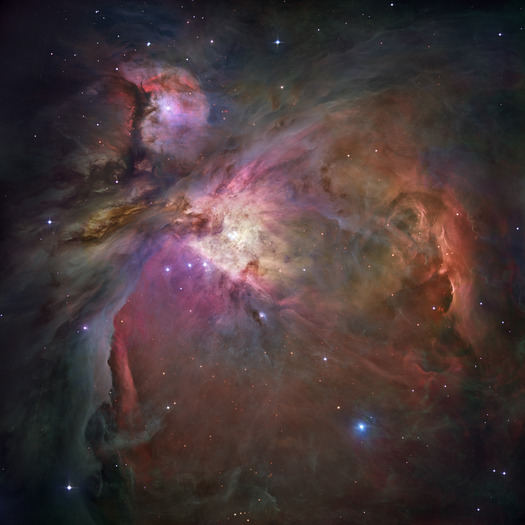 This Hubble Space Telescope picture shows the Orion Nebula. It shines because its gas is excited to emit light by the radiation of nearby stars.
