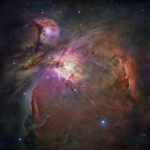 This Hubble Space Telescope picture shows the Orion Nebula. It shines because its gas is excited to emit light by the radiation of nearby stars.
