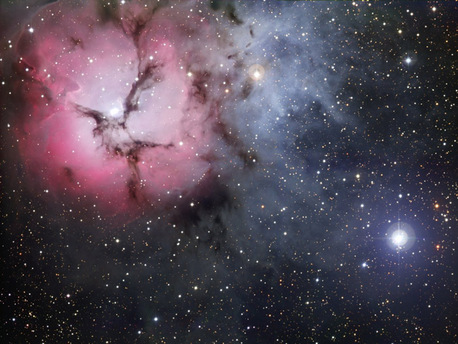 The massive star factory known as the Trifid Nebula was captured in all its glory in this image. It is named for the dark dust bands that trisect its glowing heart, the Trifid Nebula is a rare combination of three nebulae types that reveal the fury of freshly formed stars and point to more star birth in the future.