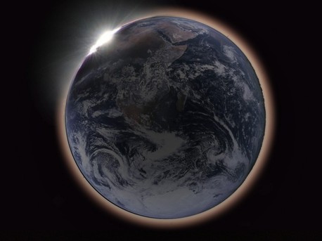 If you travel to the Moon's near side, you could see a lunar eclipse as a solar eclipse, with the disk of our fair planet Earth completely blocking out the Sun. For a moon-based observer's view, graphic artist Hana Gartstein (Haifa, Israel) offers this composite illustration. In the cropped version of her picture, an Apollo 17 image of Earth is surrounded with a red-tinted haze as sunlight streams through the planet's dusty atmosphere. Earth's night side remains faintly visible, still illuminated by the dark, reddened Moon, but the disk of the Earth would appear almost four times the size of the Sun's disk, so the faint corona surrounding the Sun would be largely obscured. At the upper left, the Sun itself is just disappearing behind the Earth's limb. 
