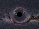 The computer-generated image shows a fictitious black hole the equivalent of 10 times the Sun's mass, viewed from a distance of 370 miles. In the background the Milky Way appears distorted due to the curvature of space.