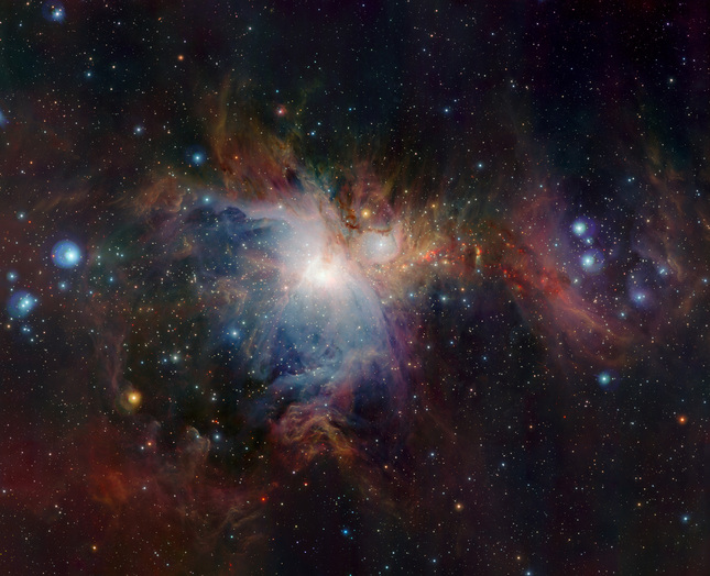 VISTA’s huge field of view allows the whole nebula and its surroundings to be imaged in a single picture and its infrared vision also means that it can peer deep into the normally hidden dusty regions and reveal the curious antics of the very active young stars buried there. This image was created from images taken through Z, J and Ks filters in the near-infrared part of the spectrum. The exposure times were ten minutes per filter. The image covers a region in the sky of about 1x1.5 degrees.