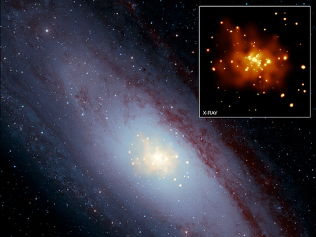 Dieses zusammengesetzte Bild des M31 (auch bekannt als die Andromeda-Galaxie) zeigt X-ray-Daten von NASA's Chandra X-ray Observatory in Gold, optische Daten aus dem Digitized Sky Survey in hellblau und Infrarot-Daten aus dem Spitzer Space Telescope in rot. 