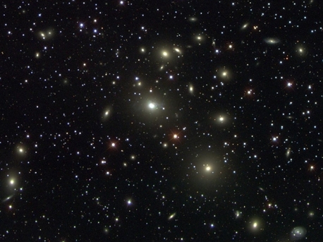 An image of a galaxy cluster in the Sloan Digital Sky Survey, showing some of the 70,000 bright elliptical galaxies that were analyzed to test general relativity on cosmic scales.