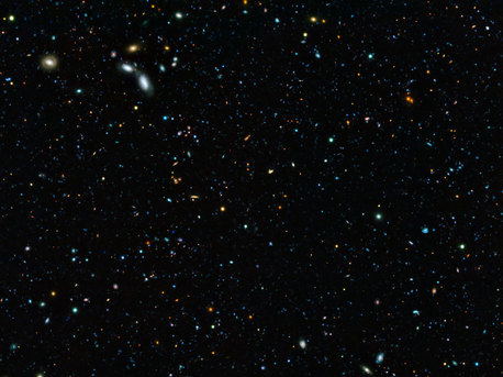 This composite image of the GOODS-South field — the result of an extremely deep survey using two of the four giant 8.2-metre telescopes composing ESO’s Very Large Telescope (VLT) and a unique custom-built filter — shows some of the faintest galaxies ever seen. It also allows astronomers to determine that 90% of galaxies whose light took 10 billion years to reach us have gone undiscovered.