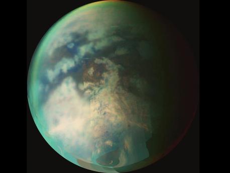 Image from NASA's Cassini spacecraft of Saturn's moon Titan. This image is a composite of several images taken during two separate Titan flybys on Oct. 9 (T19) and Oct. 25 (T20). The large circular feature near the center of Titan's disk may be the remnant of a very old impact basin. The mountain ranges to the southeast of the circular feature, and the long dark, linear feature to the northwest of the old impact scar may have resulted from tectonic activity on Titan caused by the energy released when the impact occurred.