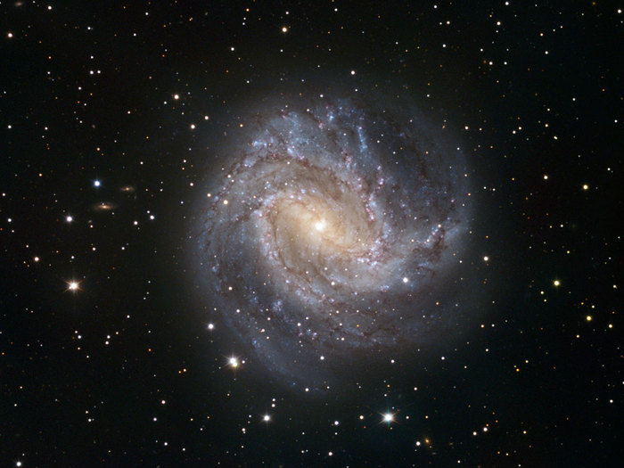 One of the TRAPPIST first light images shows the spiral galaxy Messier 83. Messier 83 lies roughly 15 million light-years away in the huge southern constellation of Hydra (the Sea Serpent). It stretches across 40 000 light-years, making it roughly 2.5 times smaller than our own Milky Way. However, in some respects, Messier 83 is quite similar to our own galaxy. Both the Milky Way and Messier 83 have a bar across their galactic nucleus, the dense spherical conglomeration of stars seen at the centre of the galaxies.

TRAPPIST (TRAnsiting Planets and PlanetesImals Small Telescope) is devoted to the study of planetary systems through two approaches: the detection and characterisation of planets located outside the Solar System (exoplanets) and the study of comets orbiting around the Sun. The 60-cm national telescope is operated from a control room in Liège, Belgium, 12 000 km away. The image was made from data obtained through three filters (B, V and R) and the field of view is about 20 arcminutes across.