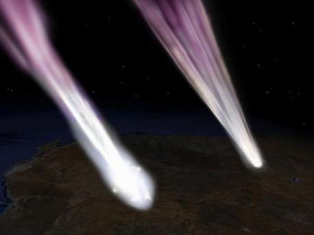 This artist's concept depicts the Hayabusa spacecraft (left) and sample return capsule (right) entering the atmosphere over South Australia. 