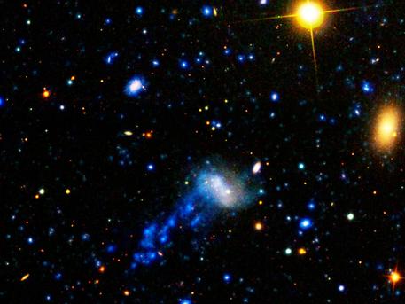 NASA's Galaxy Evolution Explorer found a tail behind a galaxy called IC 3418.