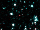 This image shows what astronomers think is one of the coldest brown dwarfs discovered so far (red dot in middle of frame). The object, called SDWFS J143524.44+335334.6, is one of 14 such brown dwarfs found by NASA's Spitzer Space Telescope using infrared light. Follow-up observations are required to nail down this "failed" star's temperature, but rough estimates put this particular object at about 700 Kelvin (800 degrees Fahrenheit).

In this image, infrared light with a wavelength of 3.6 microns is color-coded blue; 4.5-micron light is red. The brown dwarf shows up prominently in red because methane is absorbing the 3.6-micron, or blue-coded, light.