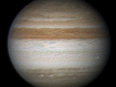 This image by amateur astronomer Christopher Go, of Cebu, Philippines, confirms that the glimmer amateur astronomer Anthony Wesley saw in his telescope on June 3, 2010, was an object burning up in the Jupiter atmosphere. Go obtained the image in blue wavelengths of light with a 28-centimeter (11-inch) telescope. He overlaid the blue-channel image on a color composite image of Jupiter.