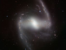 This striking new image, taken with the powerful HAWK-I infrared camera on ESO’s Very Large Telescope at Paranal Observatory in Chile, shows NGC 1365. This beautiful barred spiral galaxy is part of the Fornax cluster of galaxies, and lies about 60 million light-years from Earth. The picture was created from images taken through Y, J, H and K filters and the exposure times were 4, 4, 7 and 12 minutes respectively.