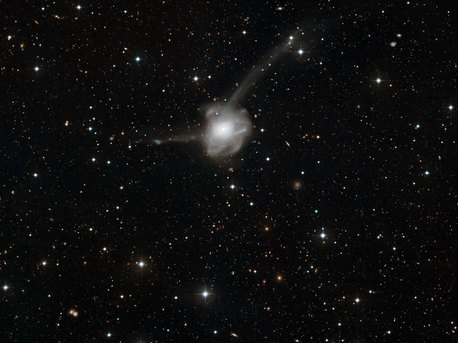 This new image shows the results of a vast collision between two galaxies. This strange object is known as NGC 7252, or Arp 226, and has the odd nickname Atoms-for-Peace. The picture was taken by the Wide Field Imager on the MPG/ESO 2.2-metre telescope at ESO’s La Silla Observatory in Chile. It is a combination of exposures taken through blue and red filters, for a total exposure time of more than four hours. The field of view is about 18 arcminutes across.
