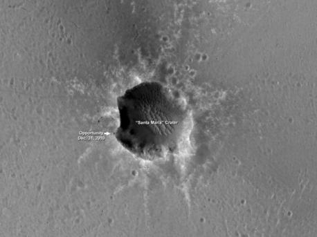 Opportunity is imaging the crater's interior to better reveal the geometry of rock layers as a means of defining the stratigraphy and the impact process. Santa Maria is a relatively young, 90-meter-diameter (295-foot-diameter) impact crater. Note the blocks of ejected material around the crater. It is old enough to collect sand dunes in its interior.

Santa Maria crater, located in Meridiani Planum, is about 6 kilometers (4 miles) from the rim of the much larger Endeavour crater, Opportunity's long-term destination. The rim of Endeavour contains spectral indications of phyllosilicates, or clay bearing minerals believed to have formed in wet conditions that could have been more habitable than the later acidic conditions in which the sulfates Opportunity has been exploring formed.

Data from the Compact Reconnaissance Imaging Spectrometer for Mars, which is also on the Mars Reconnaissance Orbiter, show indications of hydrated sulfates on the southeast edge of the Santa Maria crater. The rover team plans to use Opportunity to investigate that area through the solar conjunction period in late January and early February. During that period, Mars is almost directly behind the sun from Earth's perspective, and commanding from Earth to Mars spacecraft is restricted. After that, Opportunity will traverse to the northwest rim of Endeavour crater, aided tremendously by HiRISE images like this for navigation and targeting interesting smaller craters along the way.