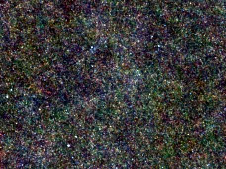 A region of the sky called the "Lockman Hole," located in the constellation of Ursa Major, is one of the areas surveyed in infrared light by the Herschel Space Observatory. All of the little dots in this picture are distant galaxies. The pattern of their collective light is what's known as the cosmic infrared background. By studying this pattern, astronomers were able to measure how much dark matter it takes to create a galaxy bursting with young stars.

Regions like this one are almost completely devoid of objects in our Milky Way galaxy, making them ideal for astronomers studying galaxies in the distant universe.