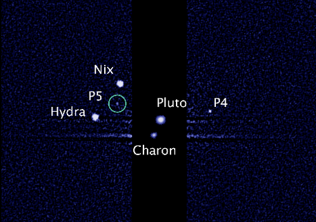 This image, taken by NASA's Hubble Space Telescope, shows five moons orbiting the distant, icy dwarf planet Pluto. The green circle marks the newly discovered moon, designated P5, as photographed by Hubble's Wide Field Camera 3 on July 7. The observations will help scientists in their planning for the July 2015 flyby of Pluto by NASA's New Horizons spacecraft. P4 was uncovered in Hubble imagery in 2011. (Credit: NASA; ESA; M. Showalter, SETI Institute)