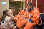 Training version of the shuttle launch in entry suit in preparation for a training session in the Space Vehicle Mockup.