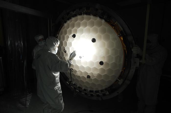 nspection of the primary mirror honeycomb structure. The mirror has been 86% light weighted. That is it only weighs 14% (1/7) that of a solid mirror of the same dimensions.